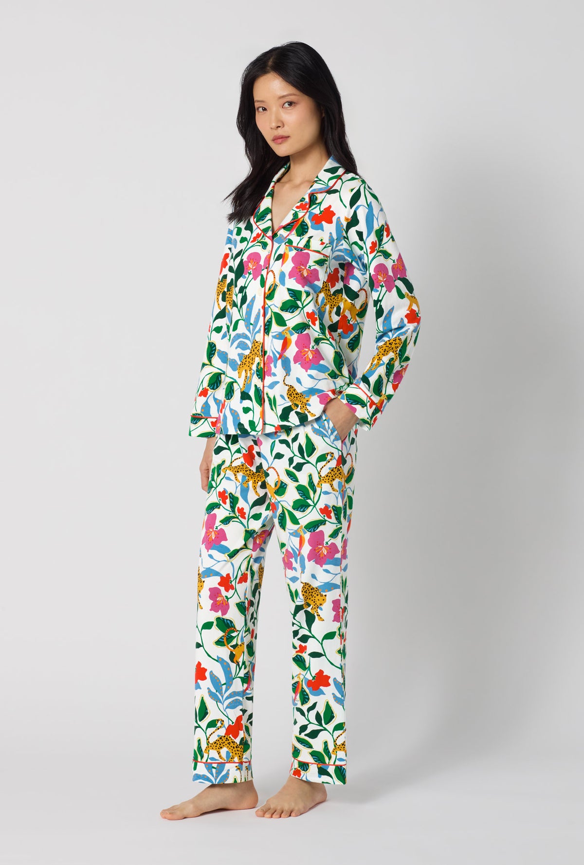 A Lady Wearing Jungle Serenade Long Sleeve Classic Stretch Jersey Pj Set facing front in a side angle view