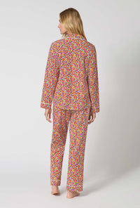 A lady wearing Ditsy Harvest Long Sleeve Classic Stretch Jersey Pj Set back view