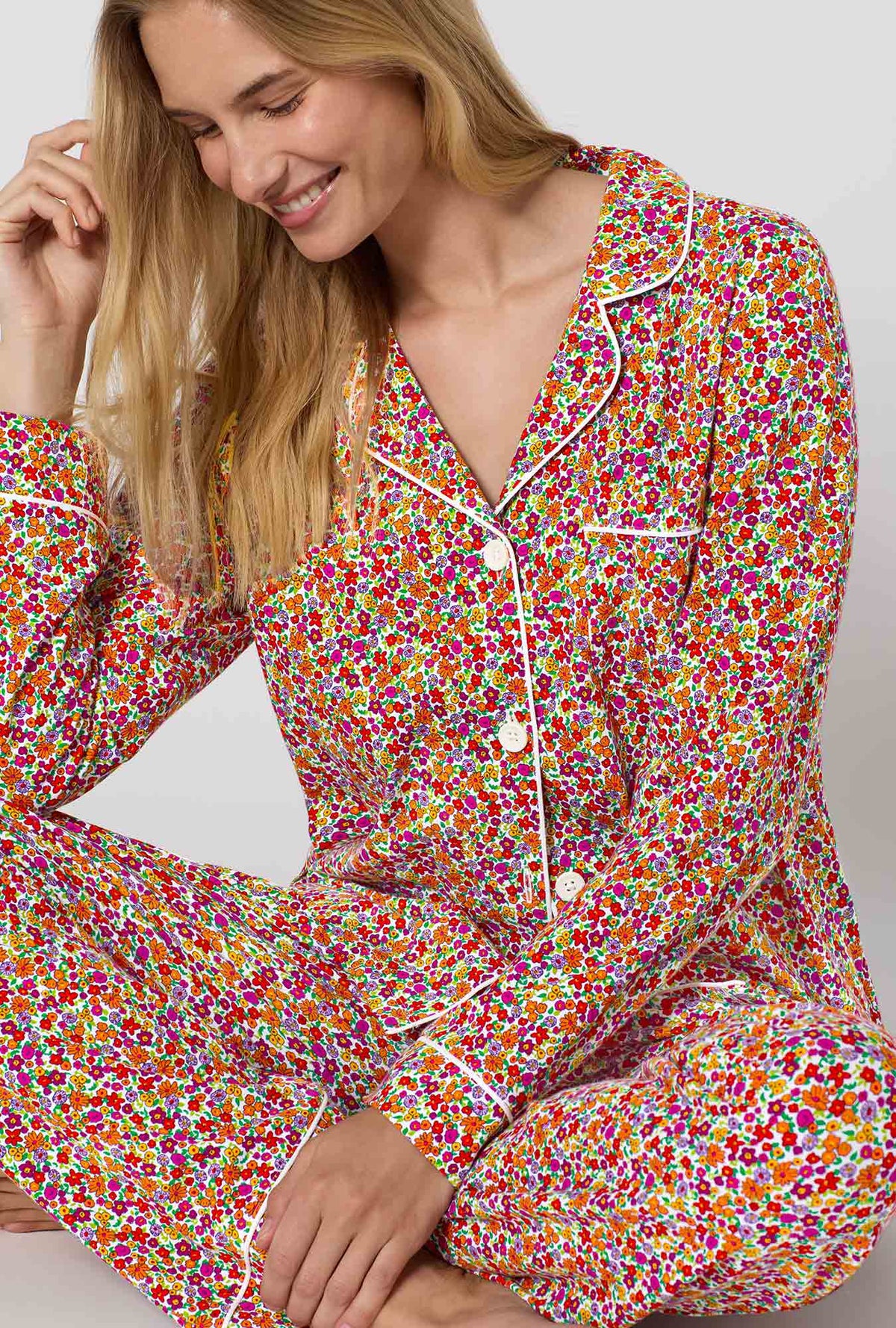 A lady wearing Ditsy Harvest Long Sleeve Classic Stretch Jersey Pj Set closer look sitting 