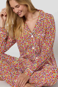 A lady wearing Ditsy Harvest Long Sleeve Classic Stretch Jersey Pj Set closer look sitting 