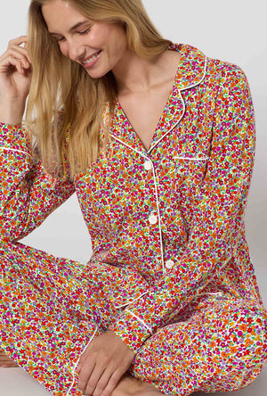 A lady wearing Ditsy Harvest Long Sleeve Classic Stretch Jersey Pj Set closer look sitting 
