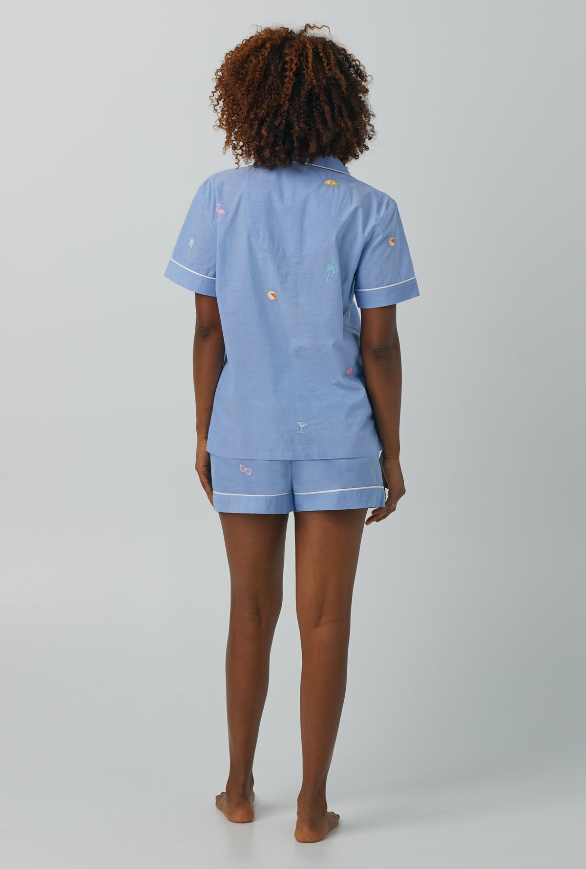 A lady wearing blue Short Sleeve Classic Woven Cotton Poplin Shorty PJ Set with Chambray print
