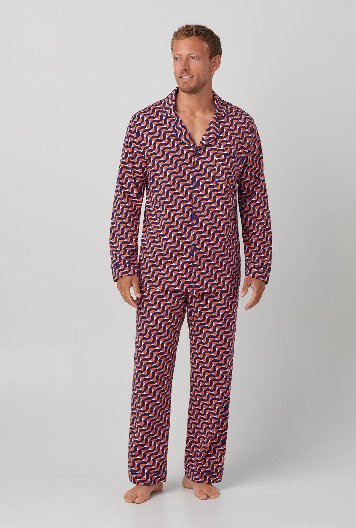 A man wearing Geo Rainbow Men&#39;s Long Sleeve Classic Stretch Jersey PJ Set