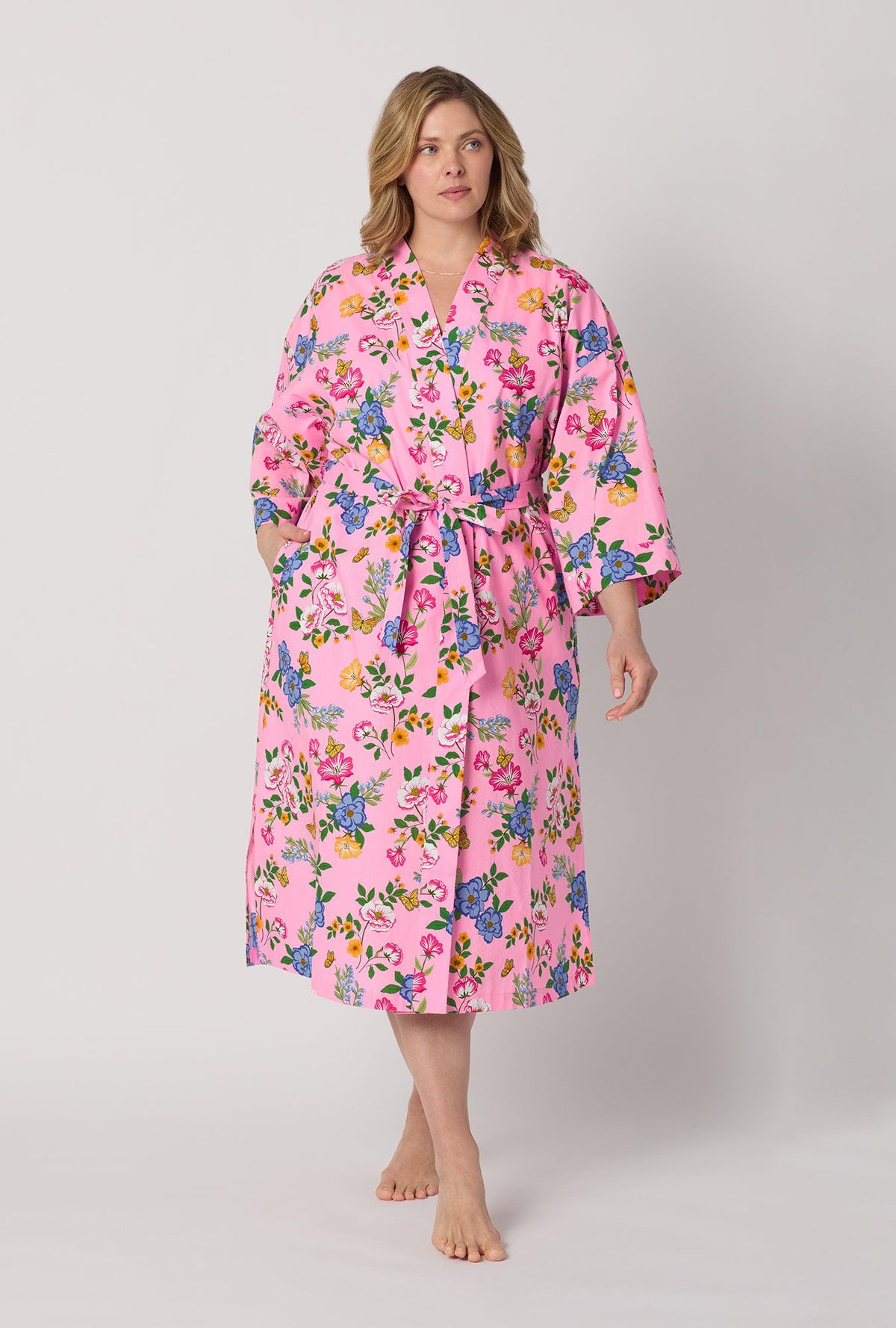 A lady one hand in pocket wearing plus size Pink Woven Cotton Poplin Kimono Robe front view