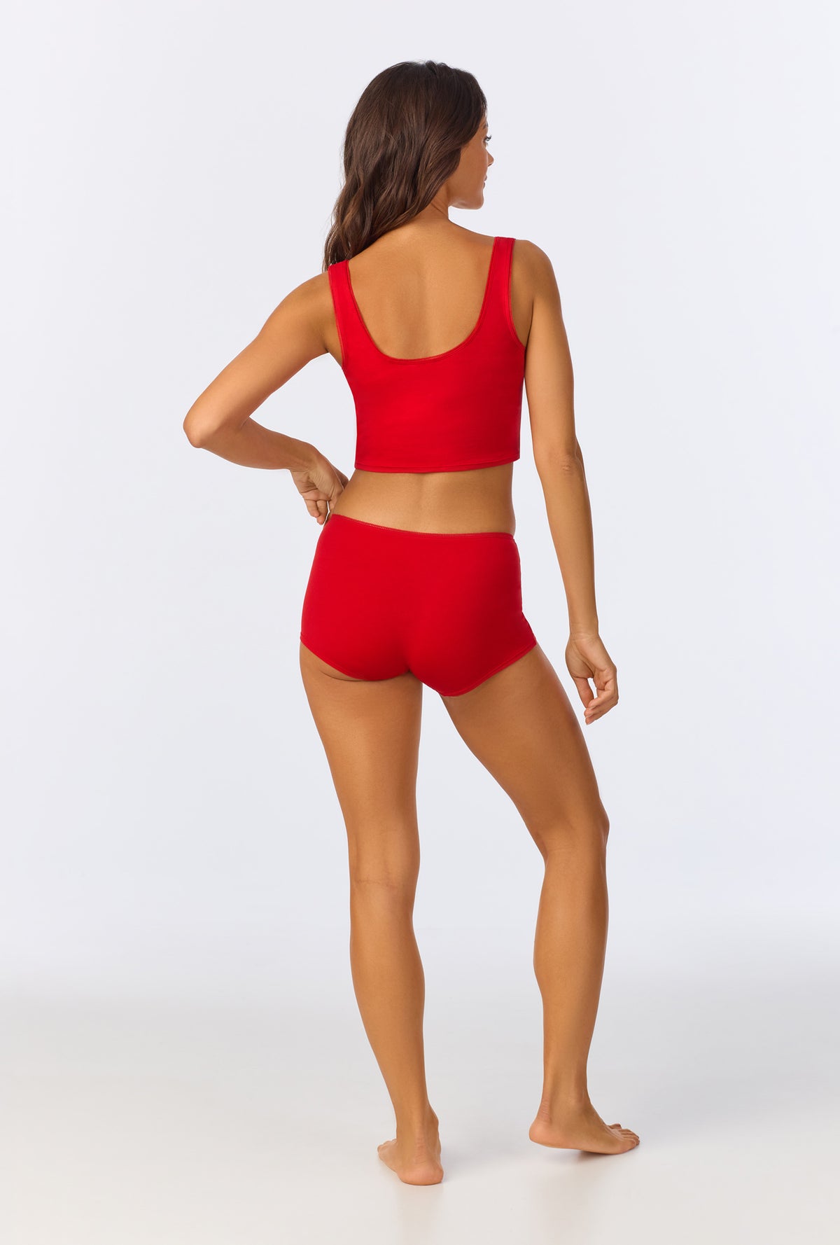 A lady wearing Mars Red Stretch Jersey Crop Tank