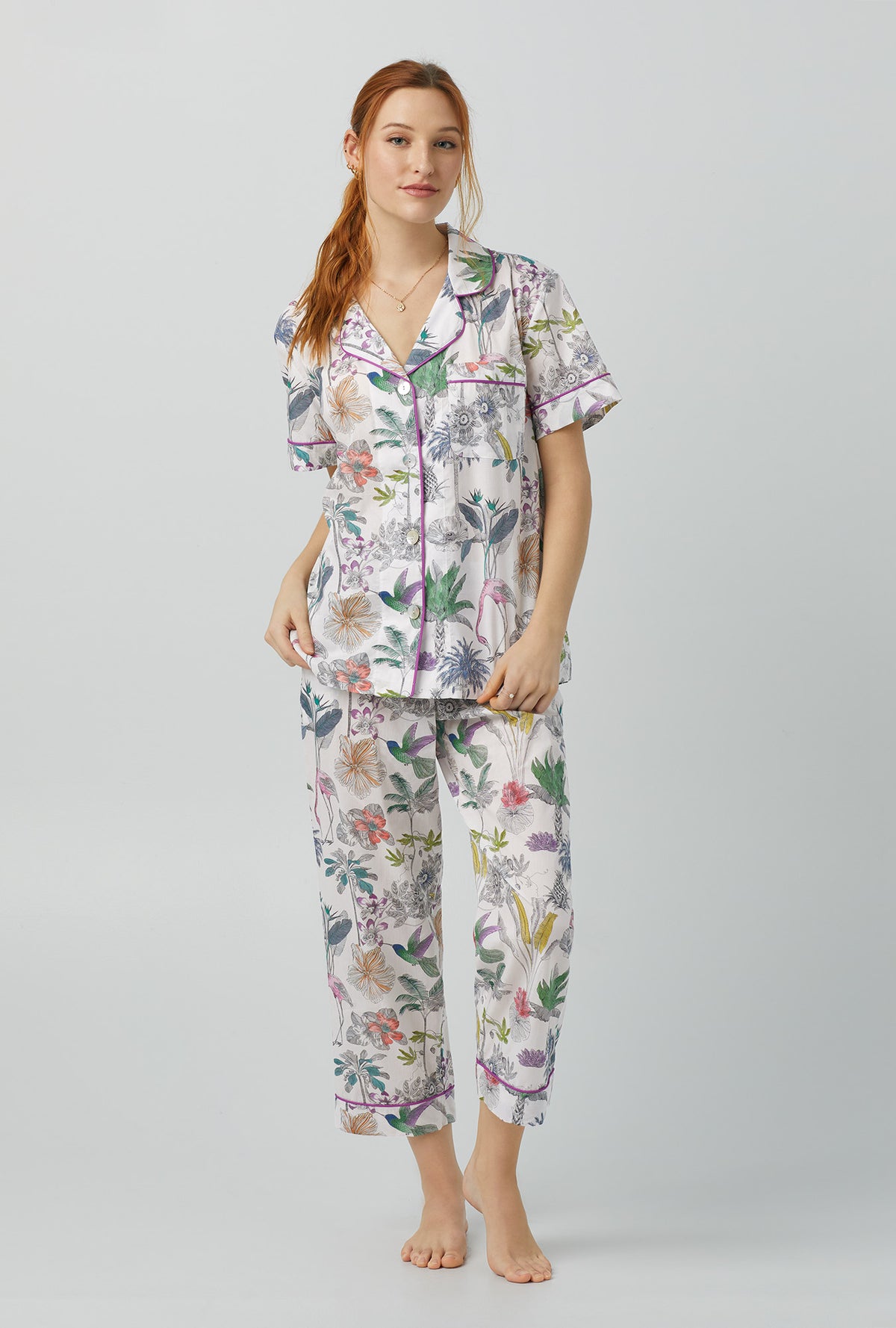 A lady wearing multi color Short Sleeve Classic Woven Cotton Cropped PJ Set with Darwin&#39;s Journey print