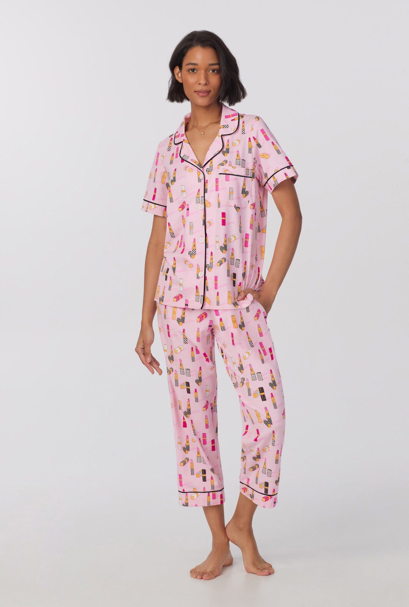 A lady wearing Short Sleeve Classic Stretch Jersey Cropped PJ Set with Pretty In Pink print