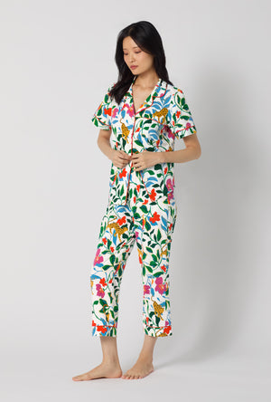 A Lady Wearing Jungle Serenade Short Sleeve Classic Stretch Jersey Cropped Pj Set posing in a side angle look