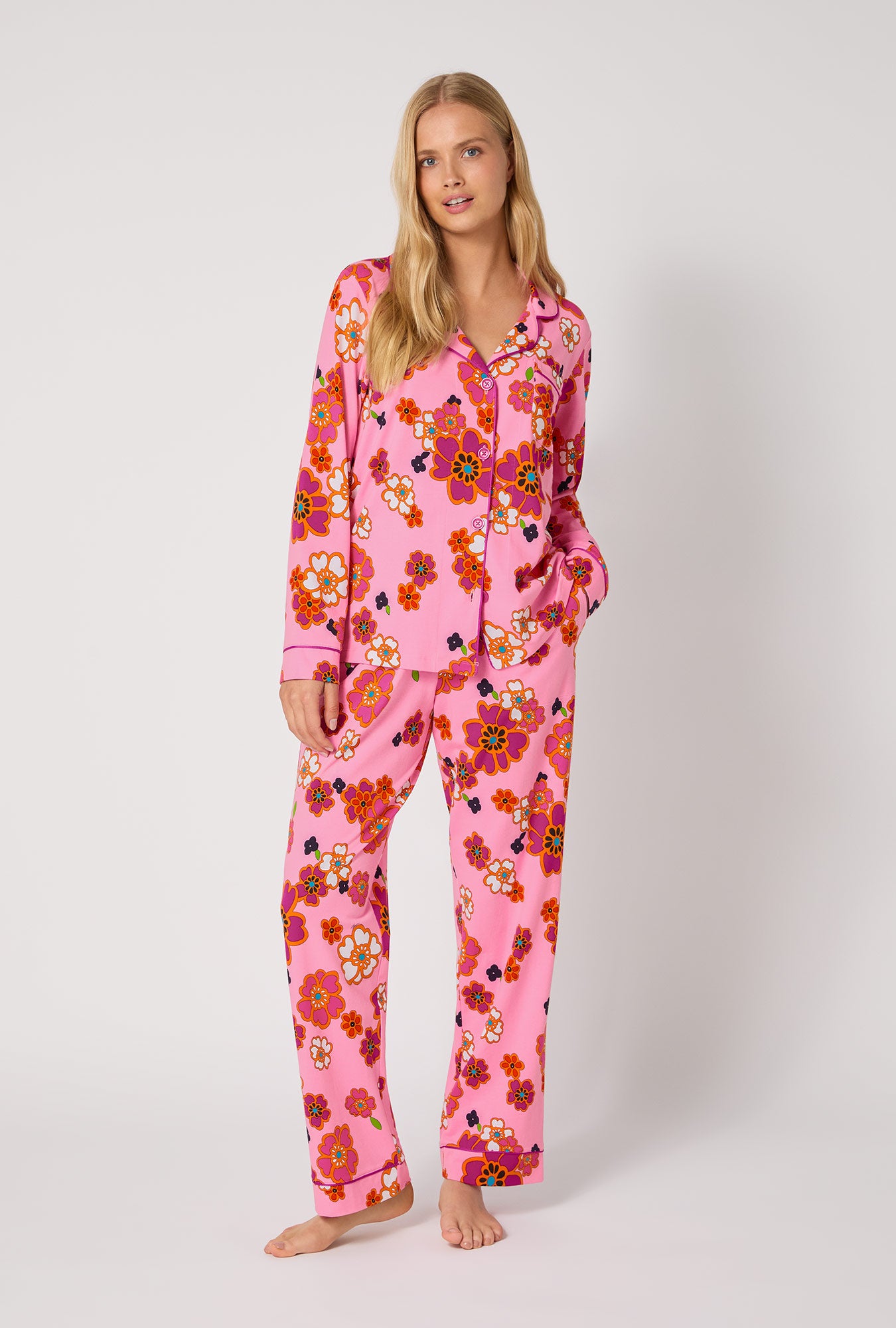 A lady wearing BedHead x Trina Turk Resort Floral Long Sleeve Classic Stretch Jersey Pj Set