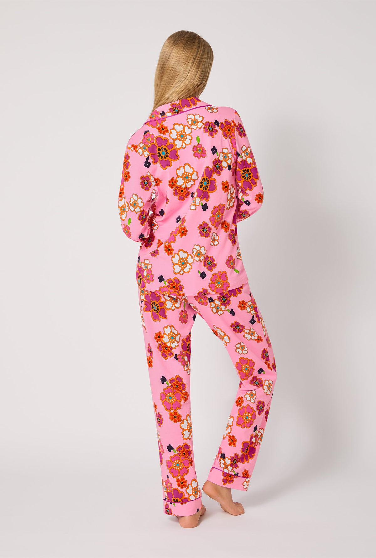 A lady wearing BedHead x Trina Turk Resort Floral Long Sleeve Classic Stretch Jersey Pj Set