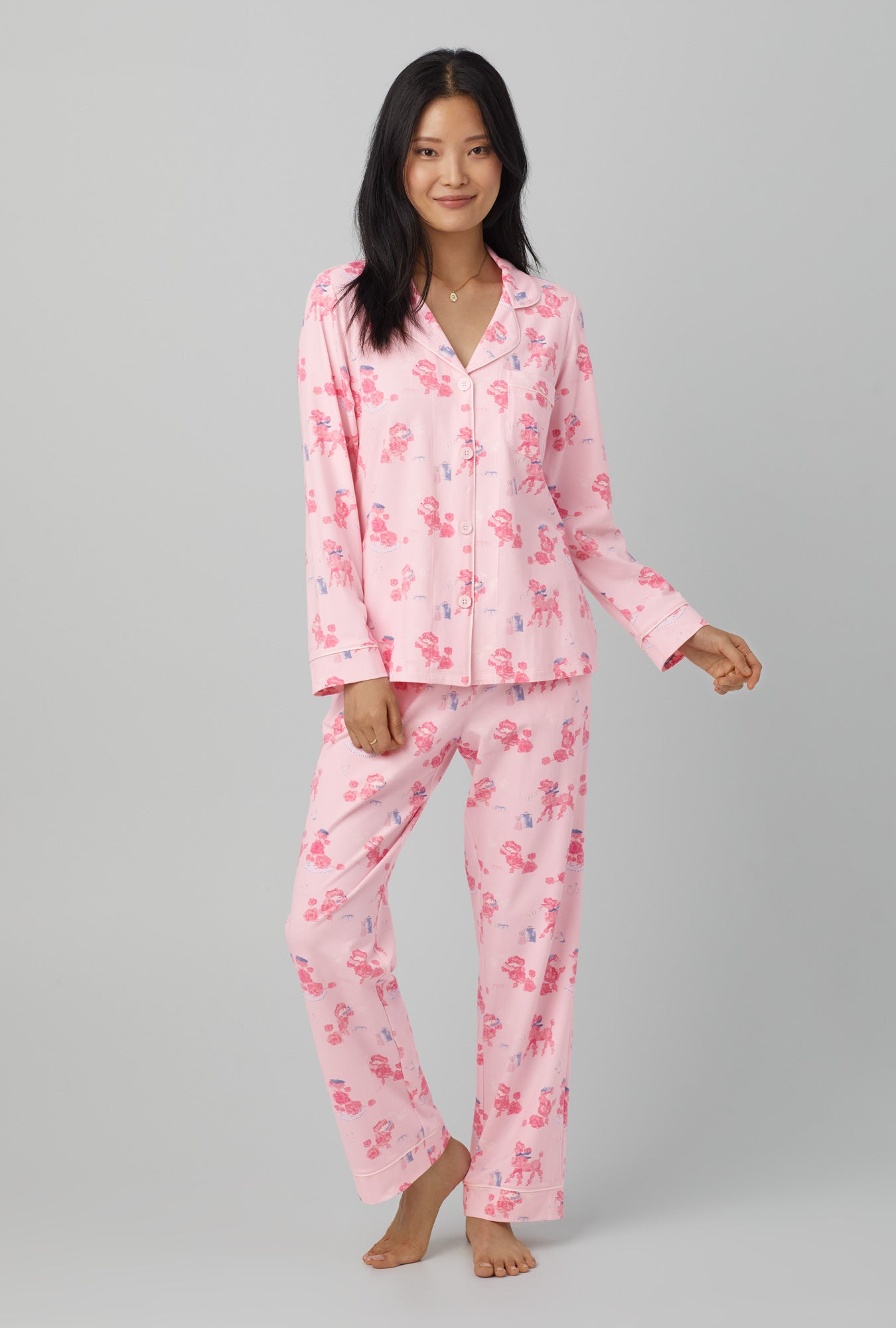 A lady wearing Pink Long Sleeve Classic Stretch Jersey PJ Set with Pampered Poodles  print