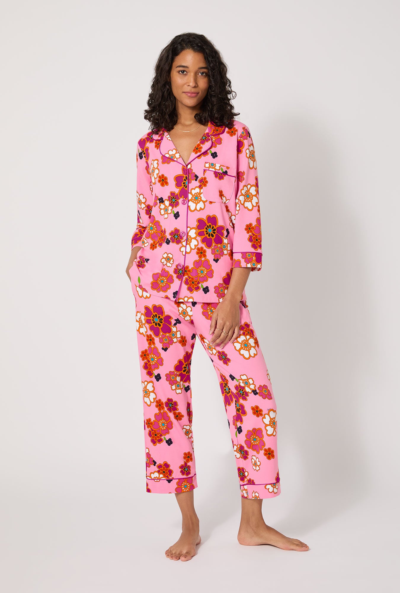 A lady wearing BedHead x Trina Turk Resort Floral 3/4 Sleeve Classic Stretch Jersey Cropped Pj Set