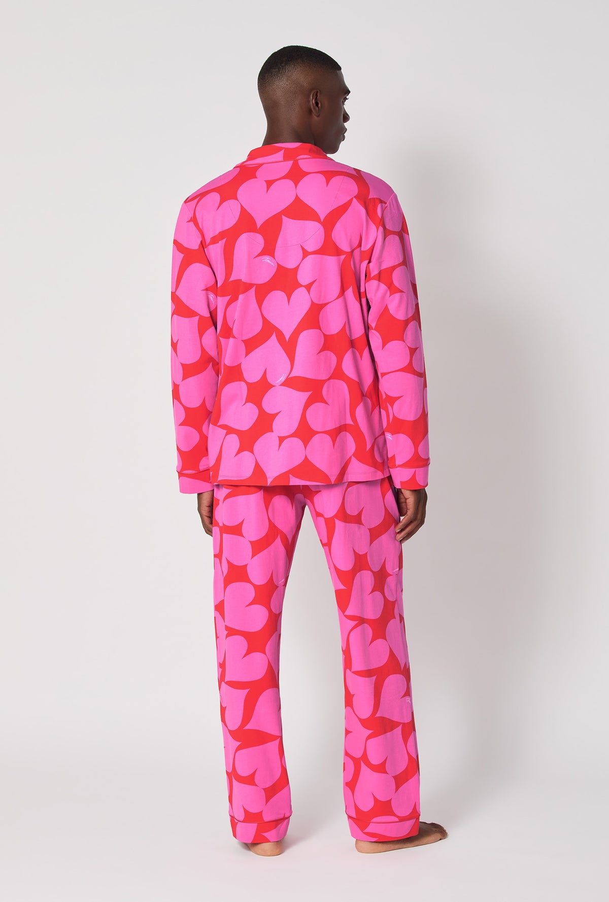 A man wearing BedHead x Mr. Turk Hearts Men's Long Sleeve Classic Stretch Jersey Pj Set