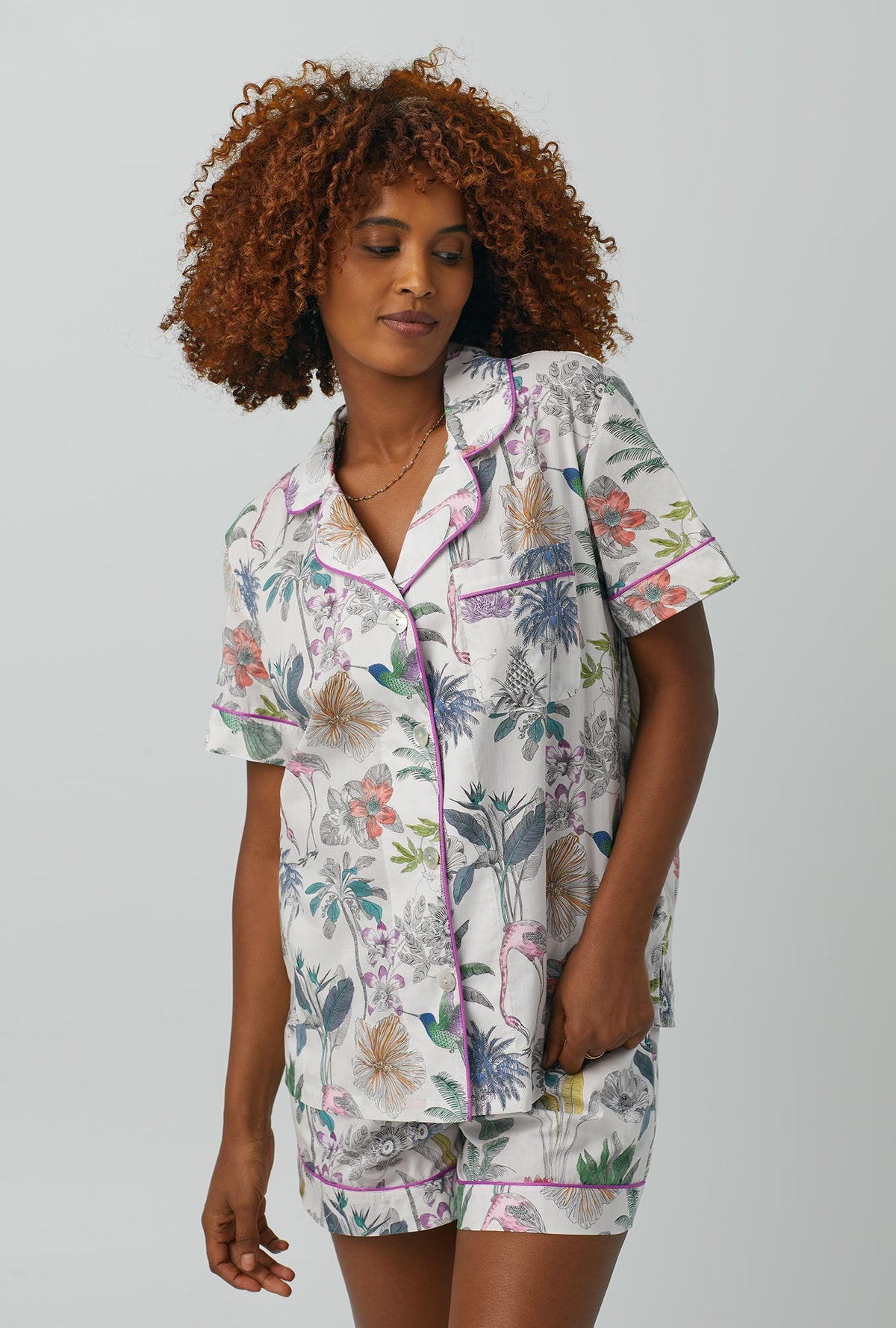 A lady wearing multi color Short Sleeve Classic Woven Cotton Shorty PJ Set with Darwin&#39;s Journey print