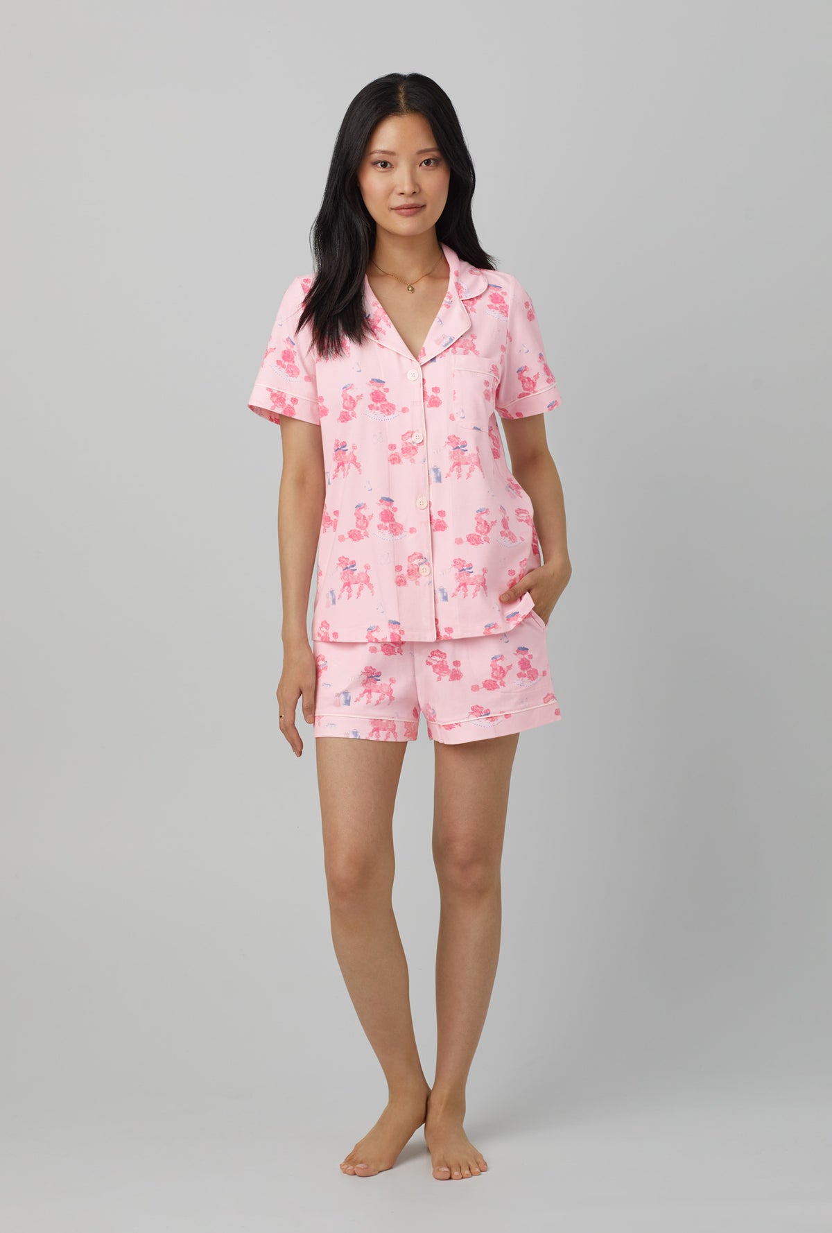A lady wearing Pink Short Sleeve Classic Short Set Stretch Jersey PJ Set with pampered Poodles print