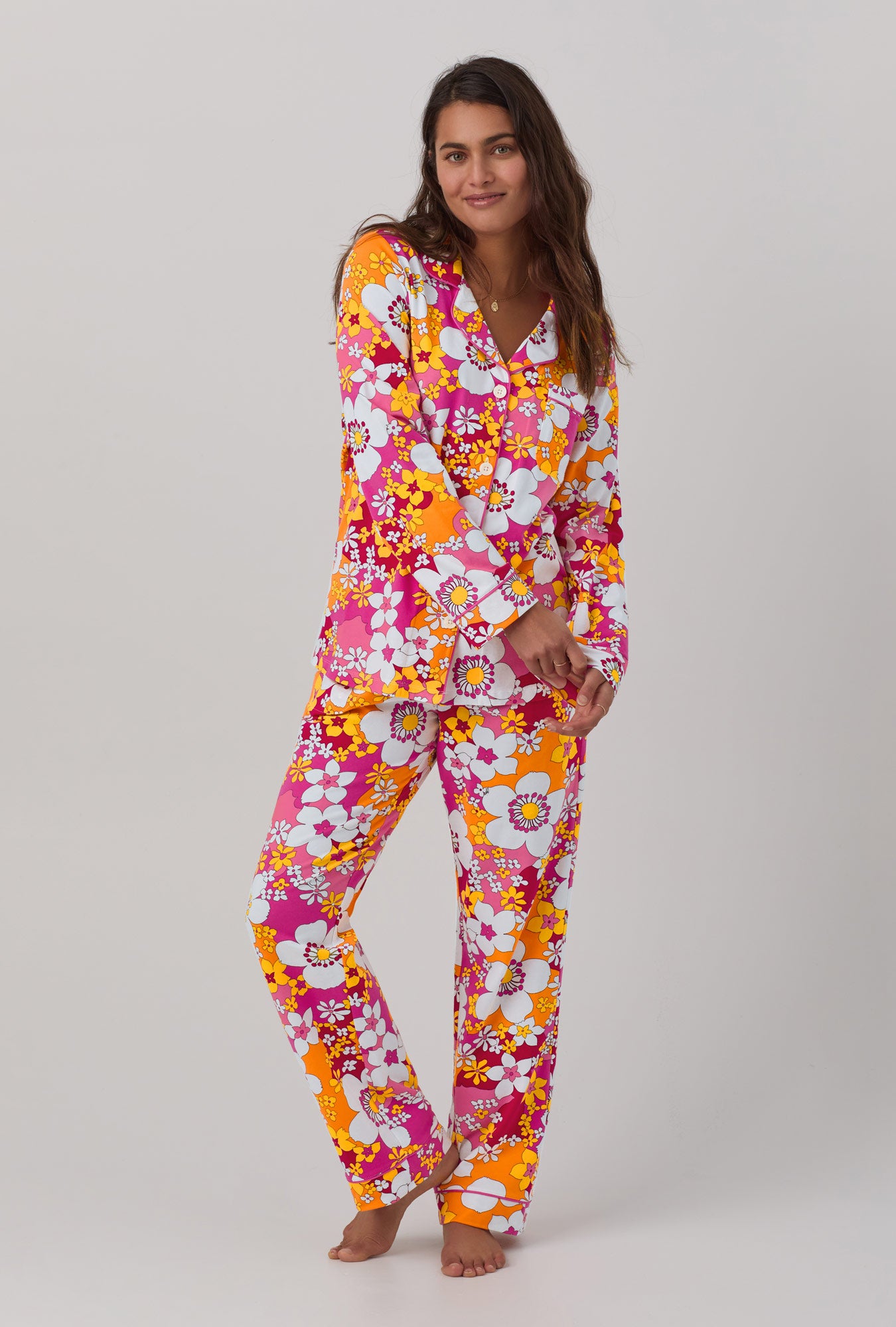 A lady wearing long sleeve classic stretch jersey pj set with bali pink floral print