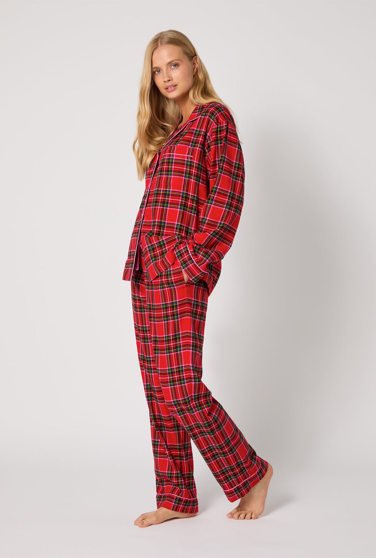 A lady wearing BedHead X Trina Turk Christmas Plaid Long Sleeve Classic Woven Portuguese Flannel PJ Set