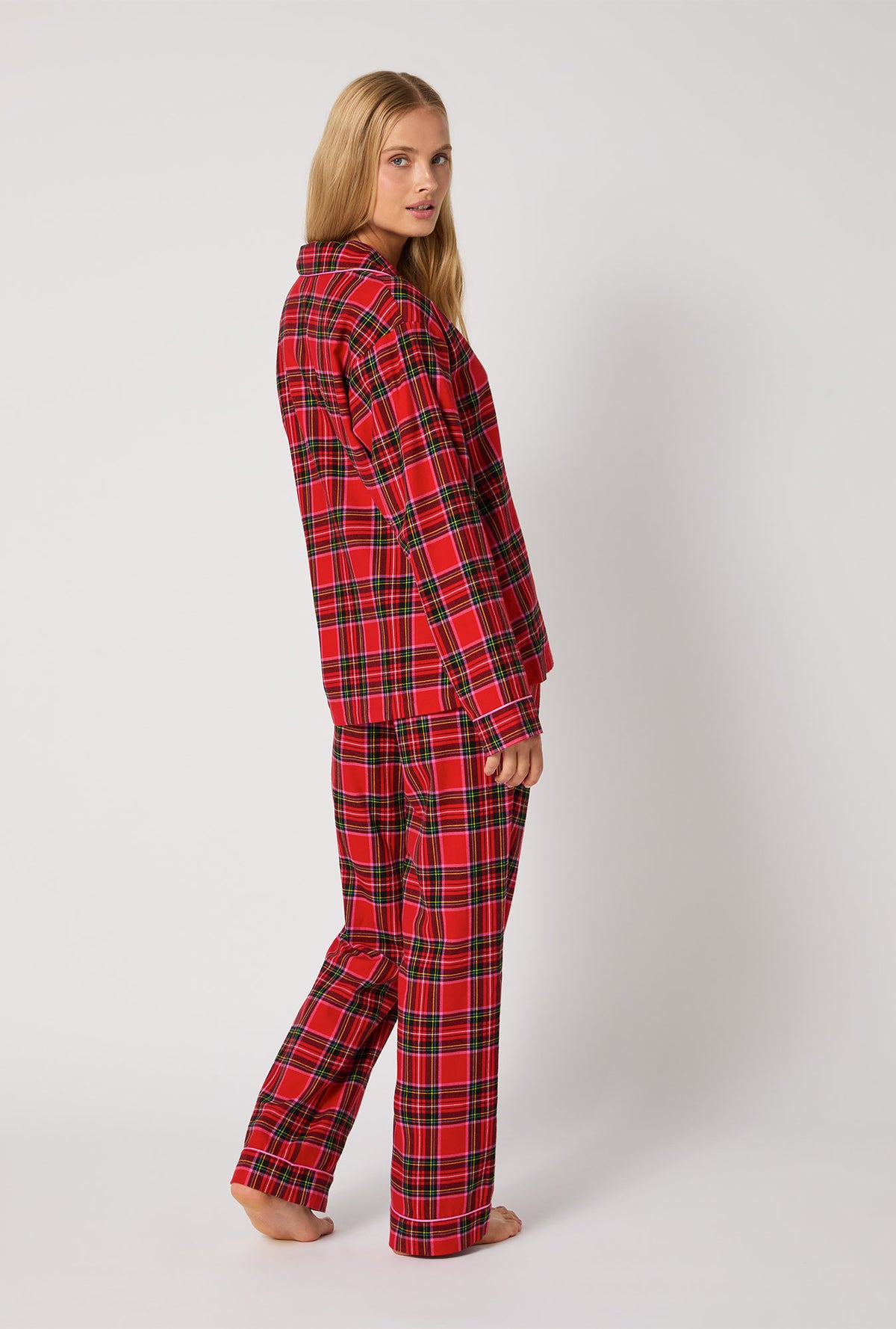 A lady wearing BedHead X Trina Turk Christmas Plaid Long Sleeve Classic Woven Portuguese Flannel PJ Set