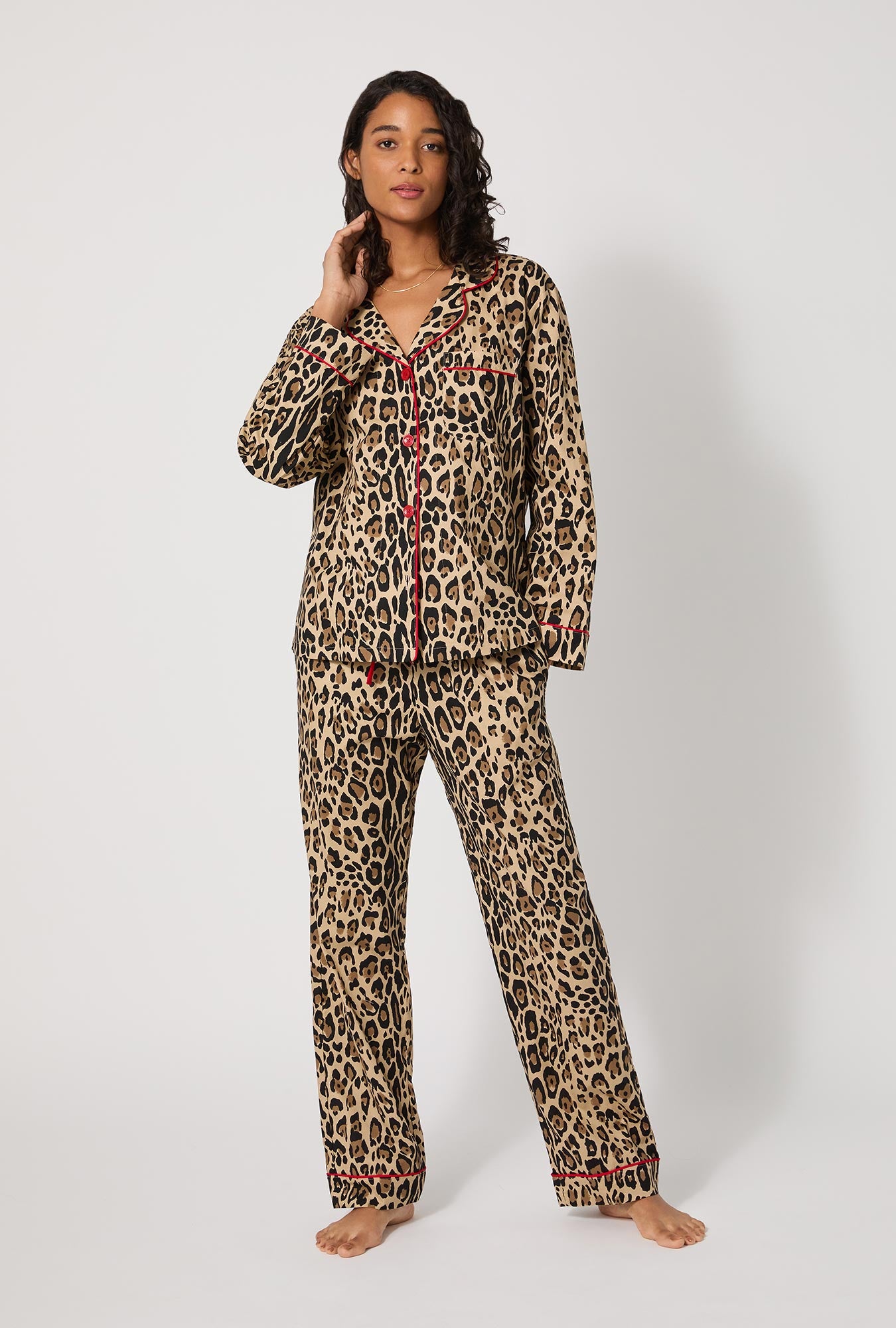 A lady wearing BedHead X Trina Turk Jaguar Stripe Long Sleeve Classic Woven Cotton Poplin Pj Set