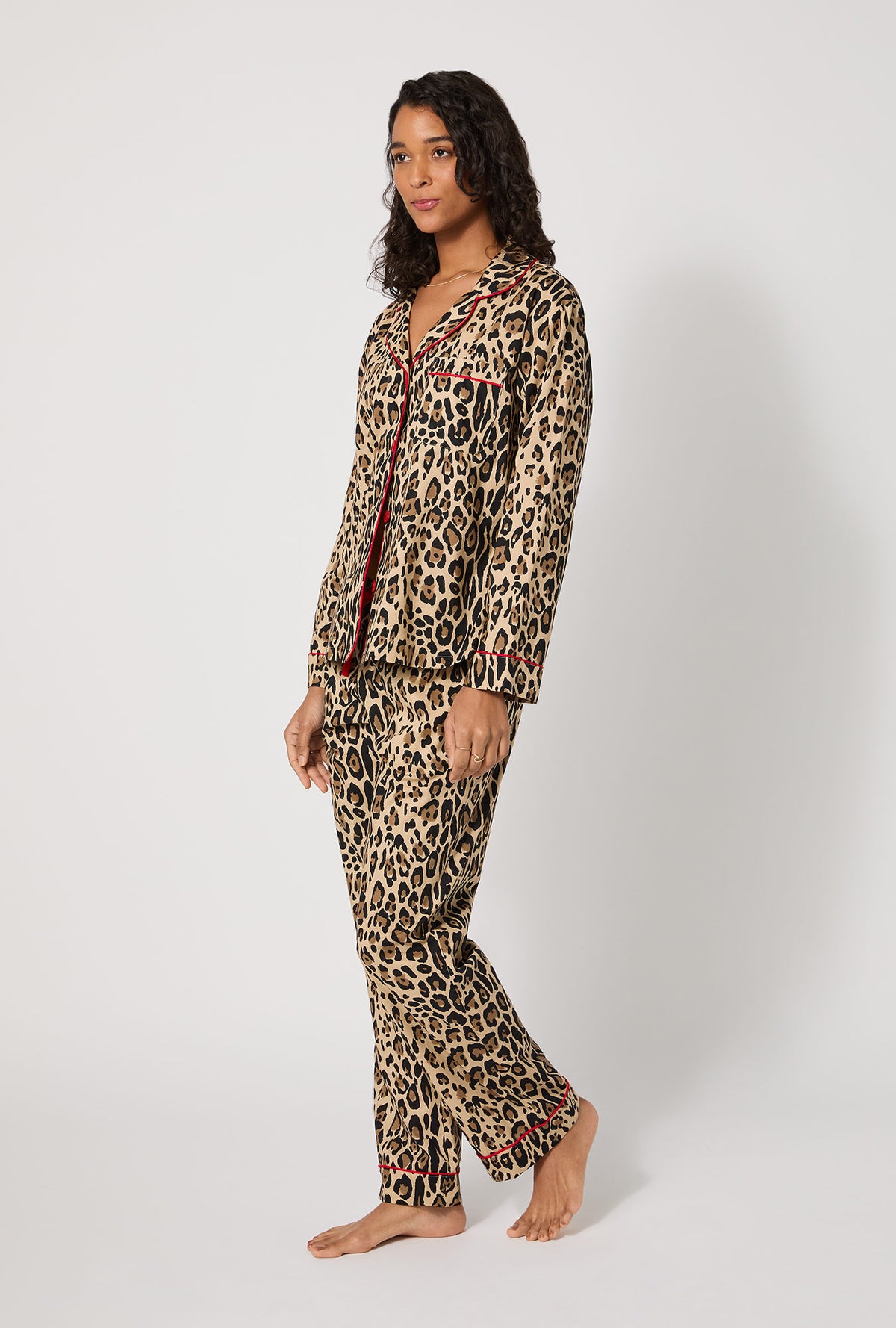 A lady wearing BedHead X Trina Turk Jaguar Stripe Long Sleeve Classic Woven Cotton Poplin Pj Set