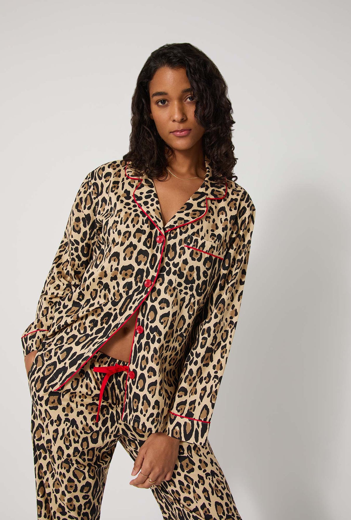 A lady wearing BedHead X Trina Turk Jaguar Stripe Long Sleeve Classic Woven Cotton Poplin Pj Set