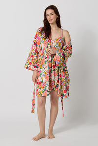 A lady wearing Rifle Paper Co. x BedHead PJs Garden Party Banded Collar Stretch Jersey Robe