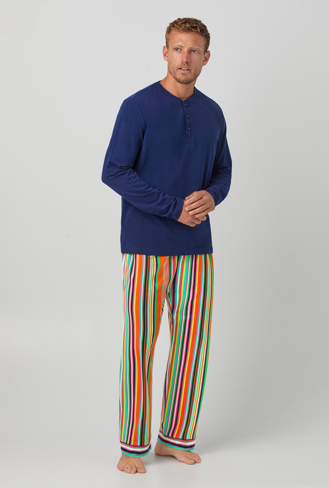 A man wearing Stripe Henley Stretch Jersey PJ Set