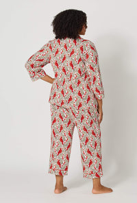 A lady wearing plus size Rifle Paper Co. x BedHead PJs Cardinals 3/4 Sleeve Classic Stretch Jersey Cropped Pj Set back view