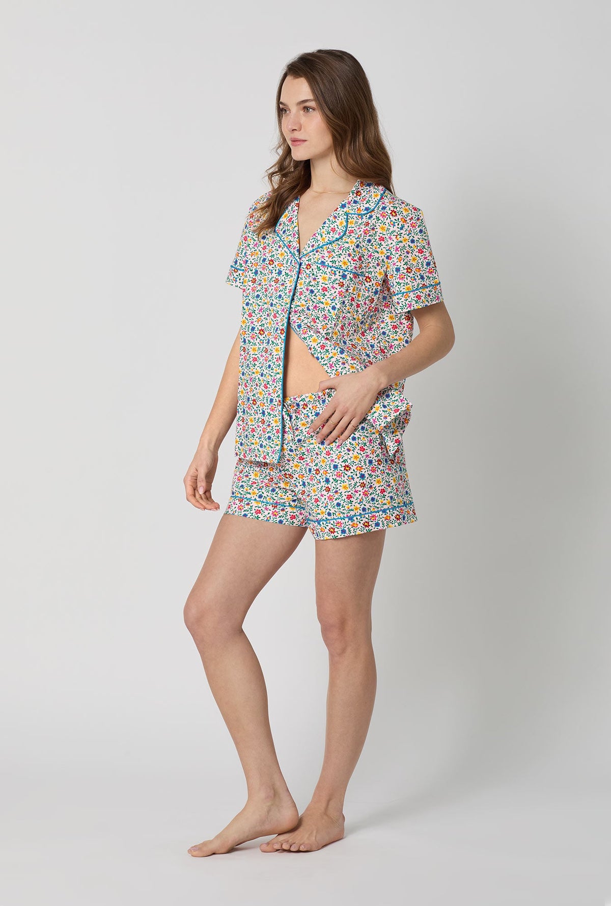 A lady wearing Multi-Color and  Pink Short Sleeve Classic Woven Cotton Poplin Shorty Pj Set side view