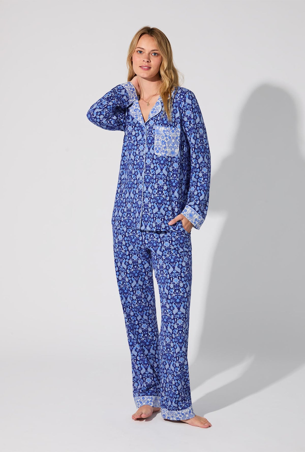 A lady wearing Bloomscape Blue Long Sleeve Classic Stretch Jersey PJ Set