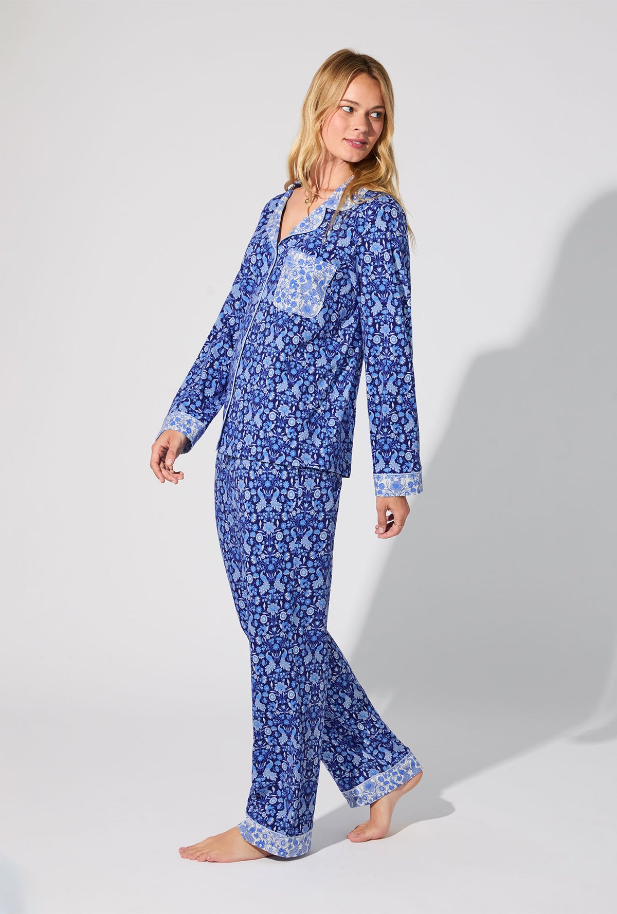 A lady wearing Bloomscape Blue Long Sleeve Classic Stretch Jersey PJ Set