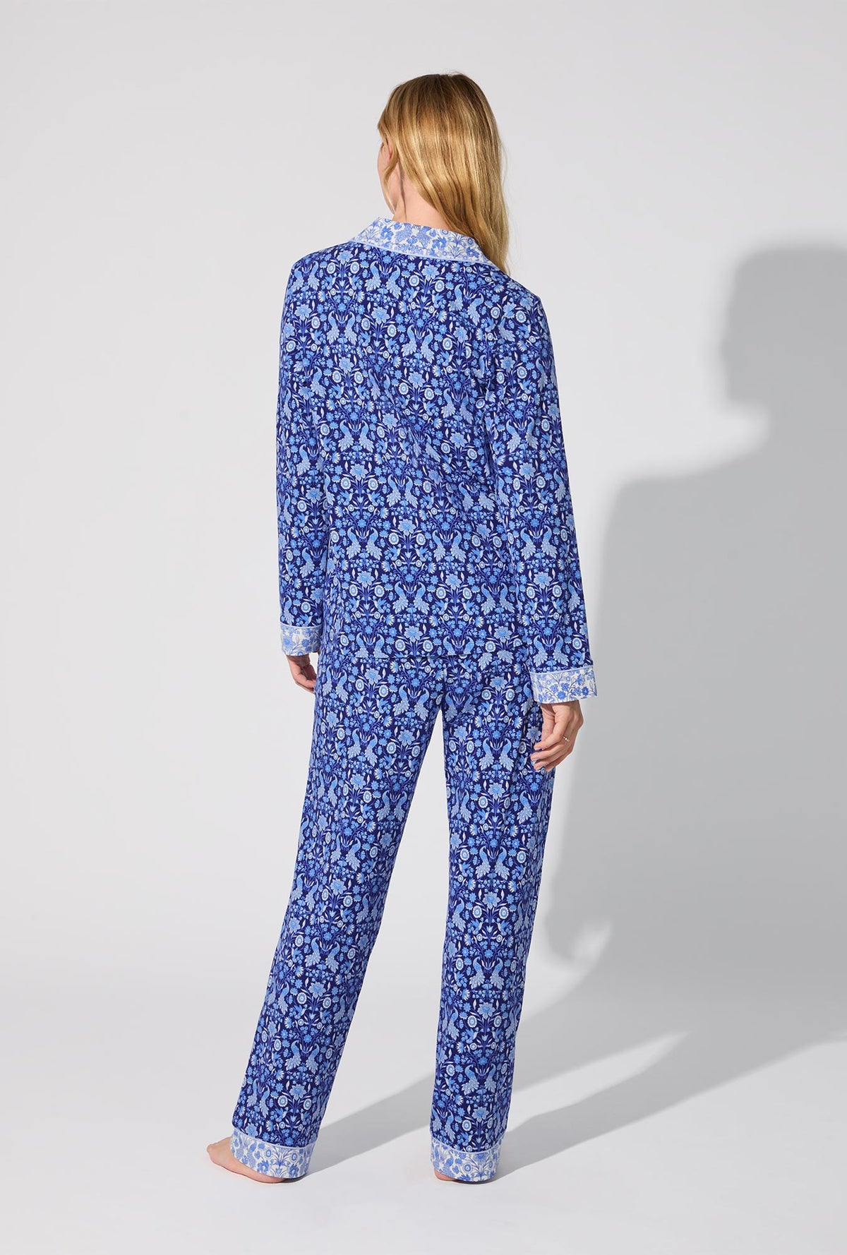 A lady wearing Bloomscape Blue Long Sleeve Classic Stretch Jersey PJ Set