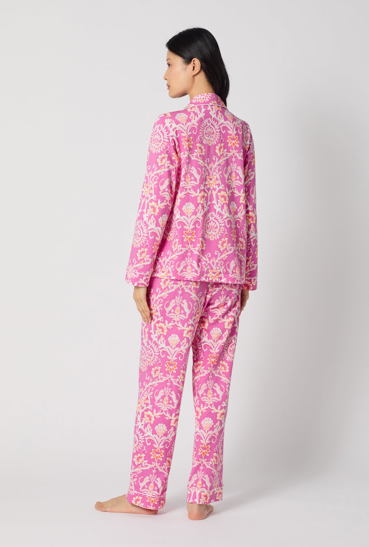 A Lady Wearing Luxe Leopard Long Sleeve Classic Stretch Jersey Pj Set turned back while looking to the side