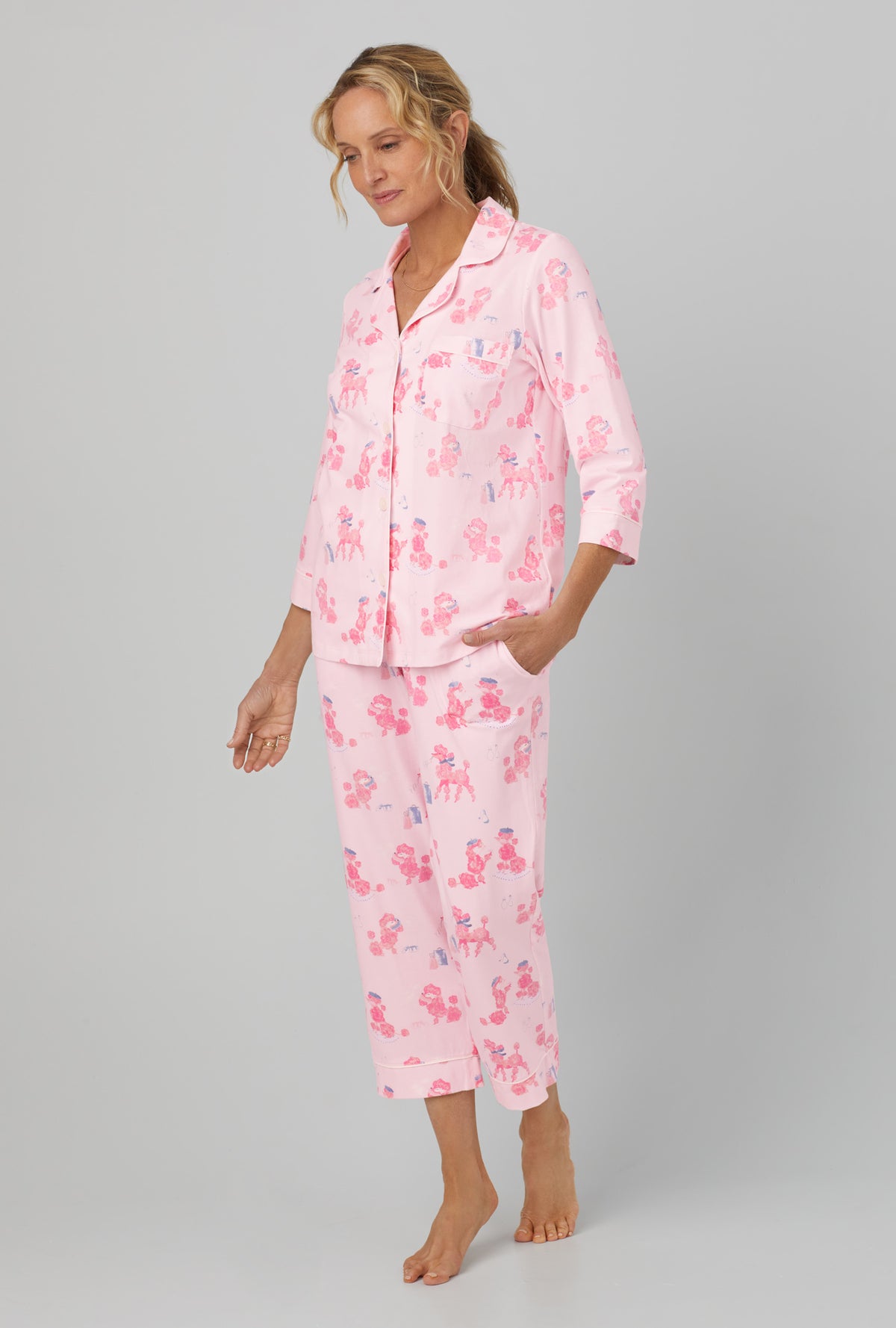 A lady wearing Pink 3/4 Sleeve Classic Stretch Jersey Cropped PJ Set with Pampered Poodles  print
