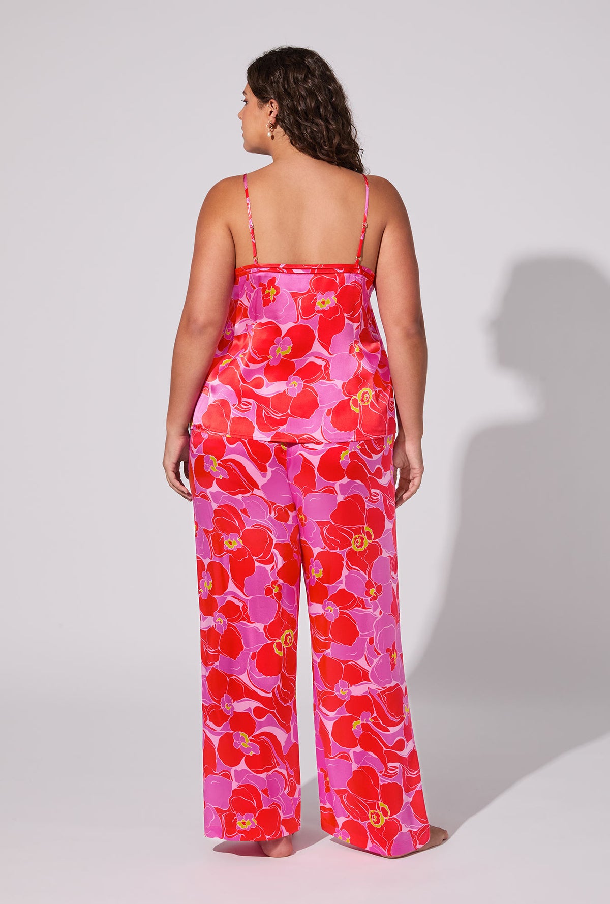 A lady wearing BedHead X Trina Turk Winter Orchids Cami Tank Woven Washable Silk Long plus PJ Set