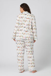 A lady wearing plus size Run NYC Run Long Sleeve Classic Stretch Jersey Pj Set back view