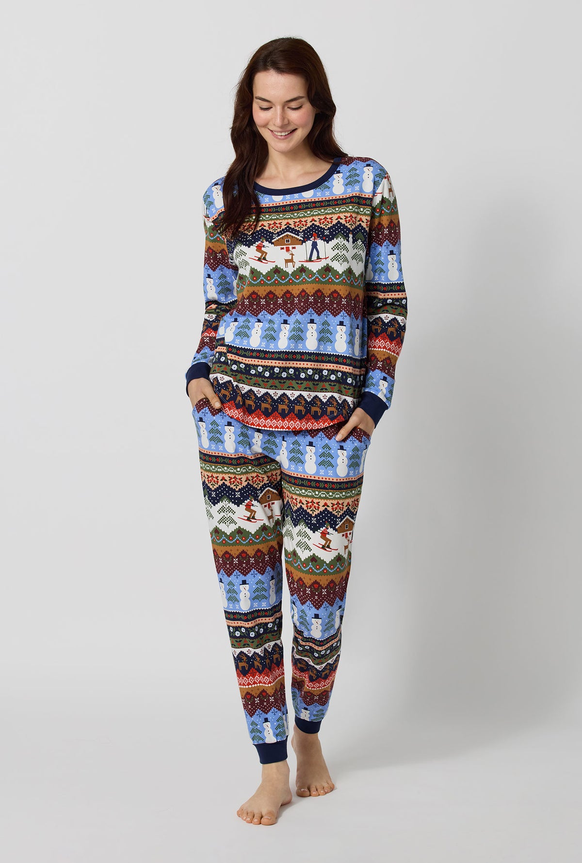 A lady wearing Rifle Paper Co. x BedHead PJs Ski Chalet Long Sleeve Pullover Crew And Jogger Stretch Jersey Pj Set looking down