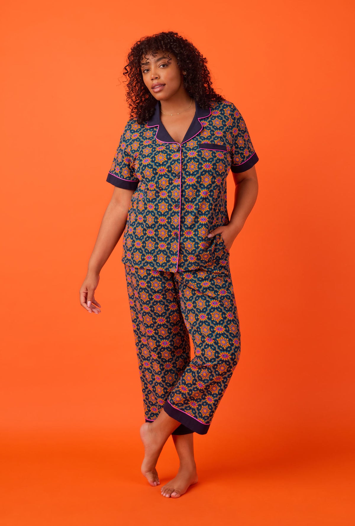 A lady wearing Short Sleeve Classic Stretch Jersey Cropped PJ Set with Navy Royal Foulard print