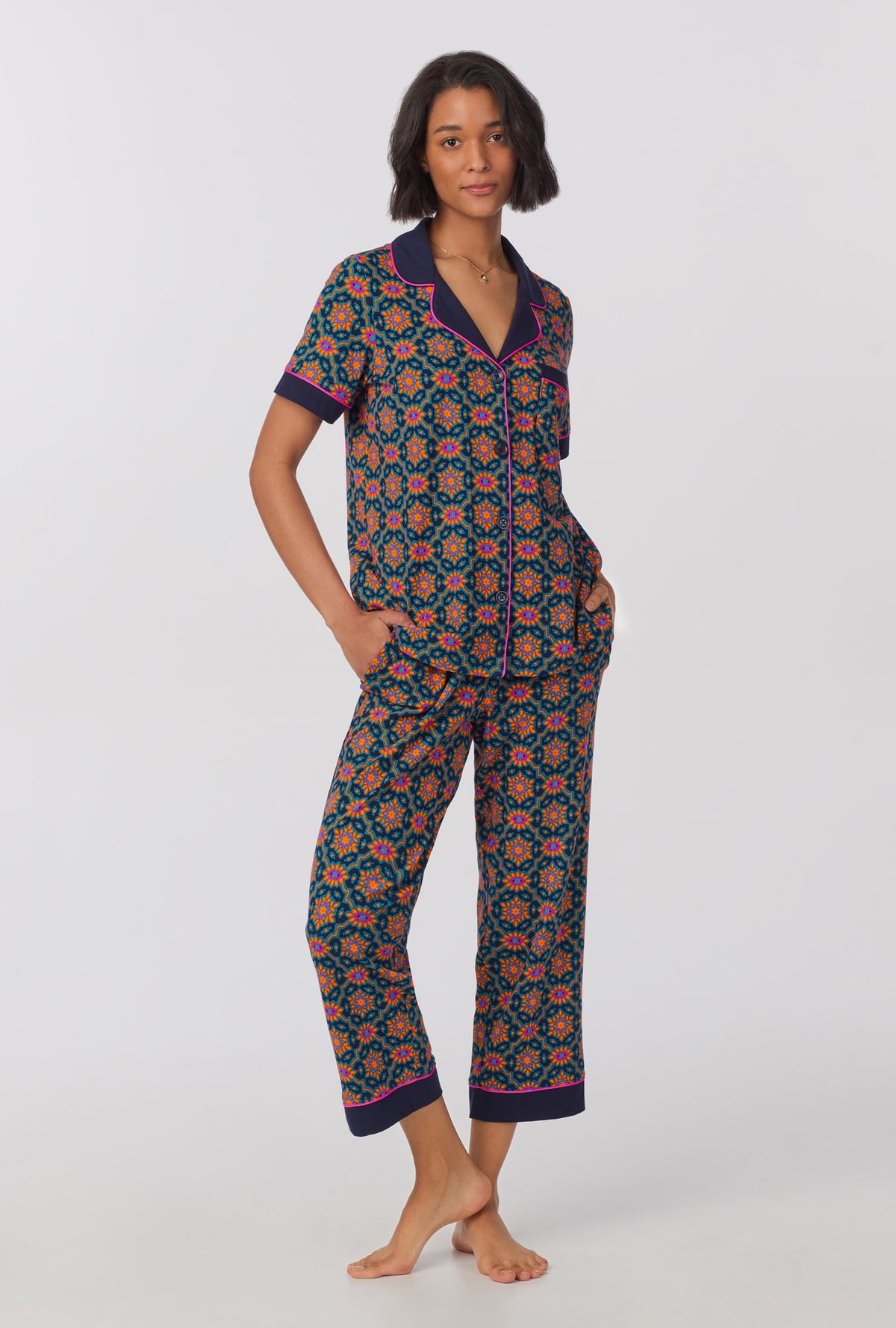 A lady wearing Short Sleeve Classic Stretch Jersey Cropped PJ Set with Navy Royal Foulard print