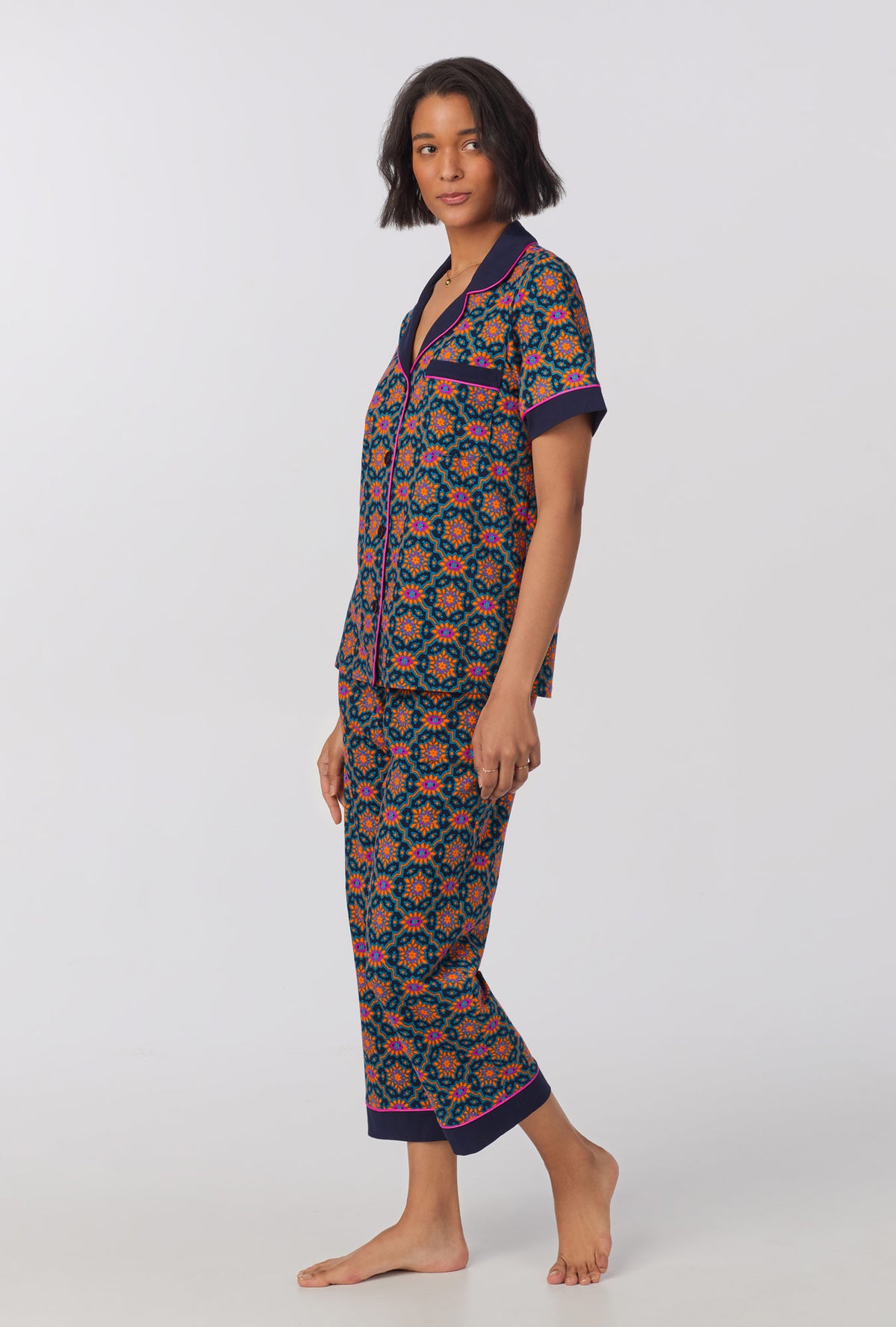 A lady wearing Short Sleeve Classic Stretch Jersey Cropped PJ Set with Navy Royal Foulard print