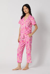 A Lady Wearing Luxe Leopard Short Sleeve Classic Stretch Jersey Cropped Pj Set posing in a side angle view
