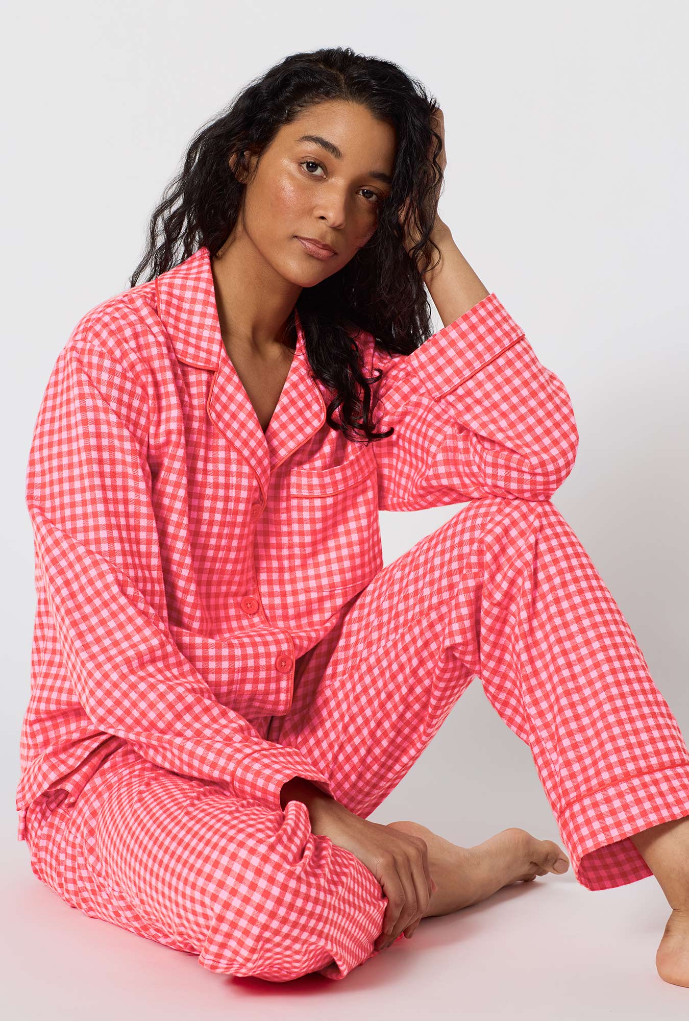 A lady wearing Jane Gingham Long Sleeve Classic Woven Portuguese Flannel Pj Set sitting down