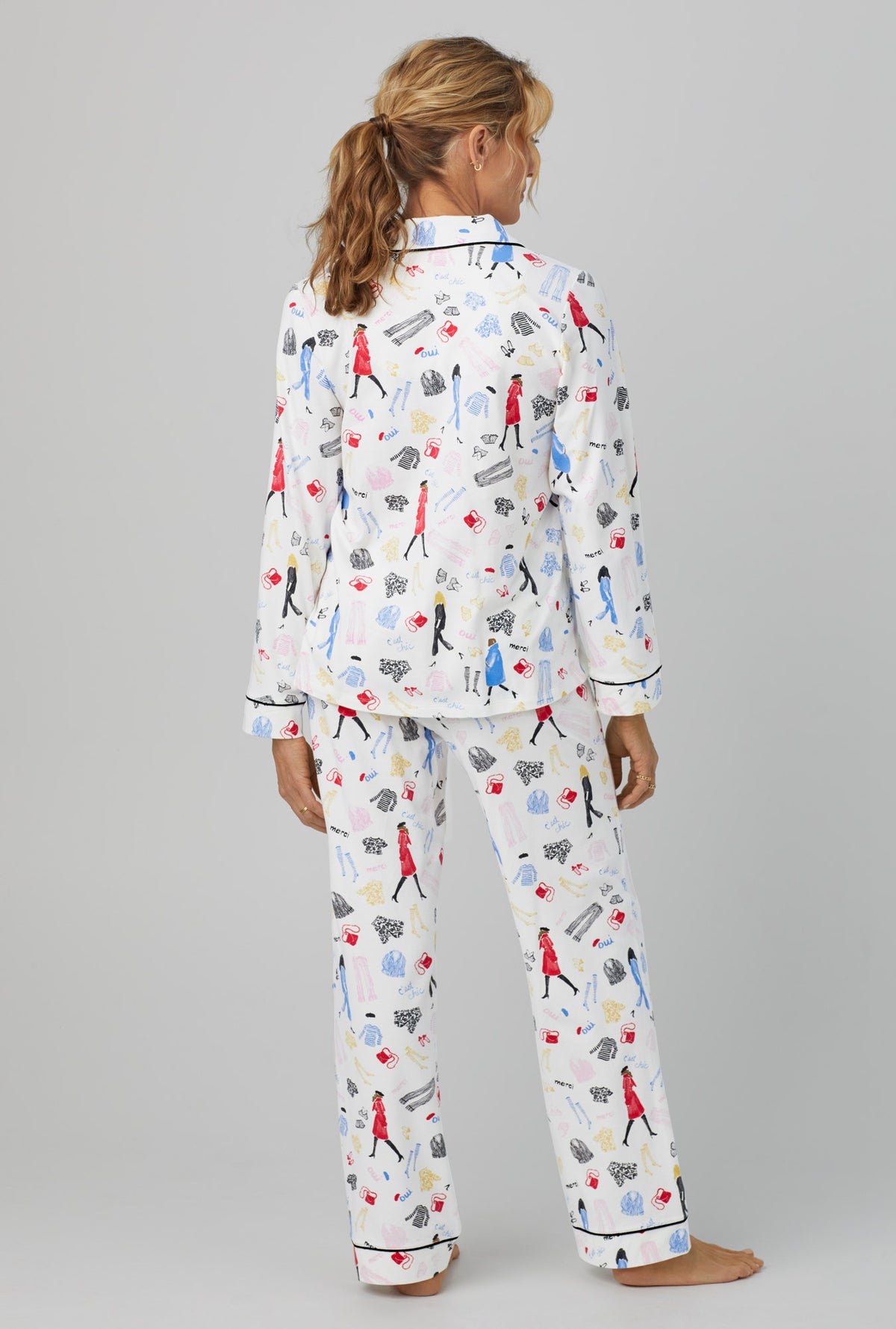 A lady wearing  white Long Sleeve Classic Stretch Jersey PJ Set with Cest Chic  print
