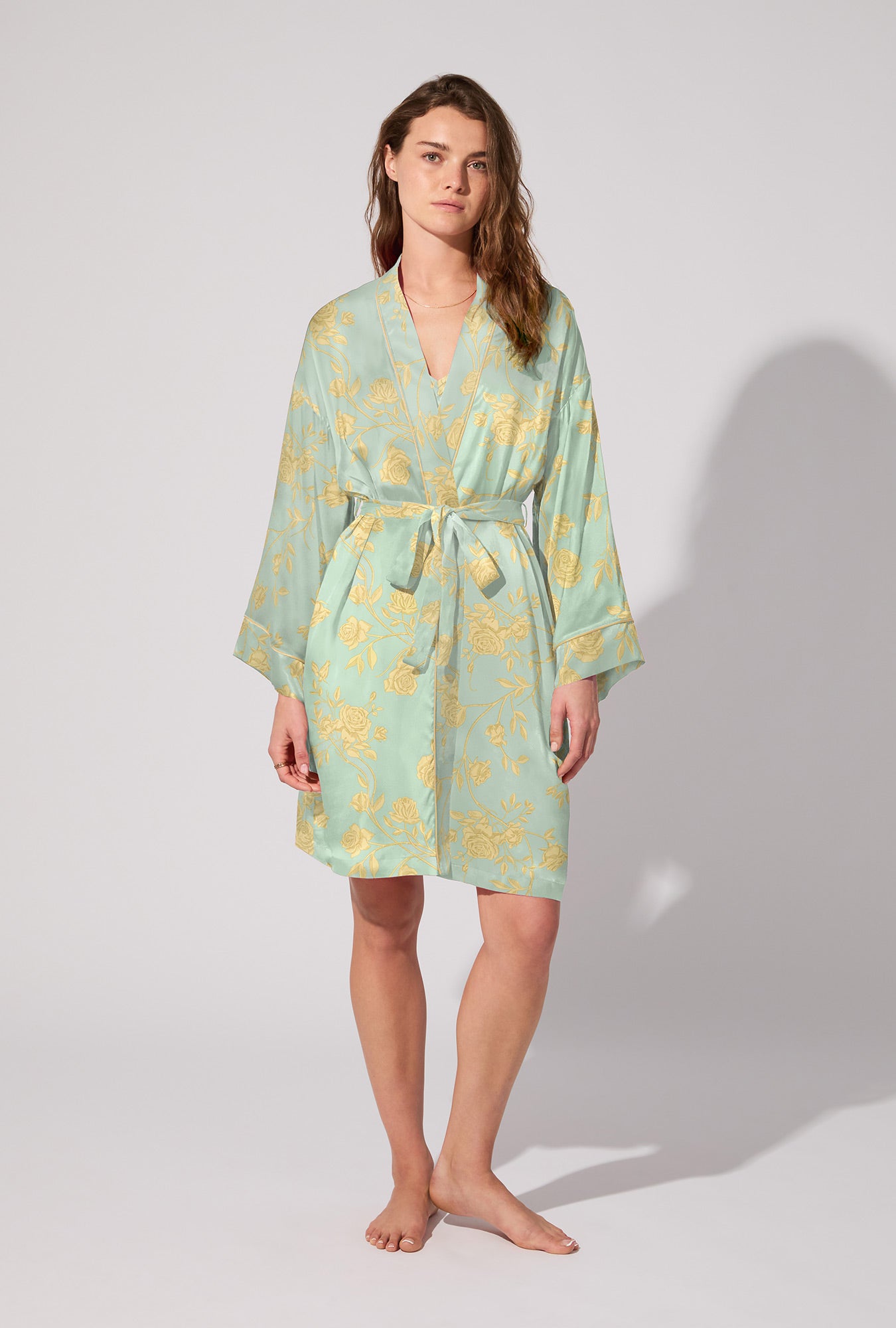 A lady wearing Royal Roses Woven Washable Silk Satin Robe