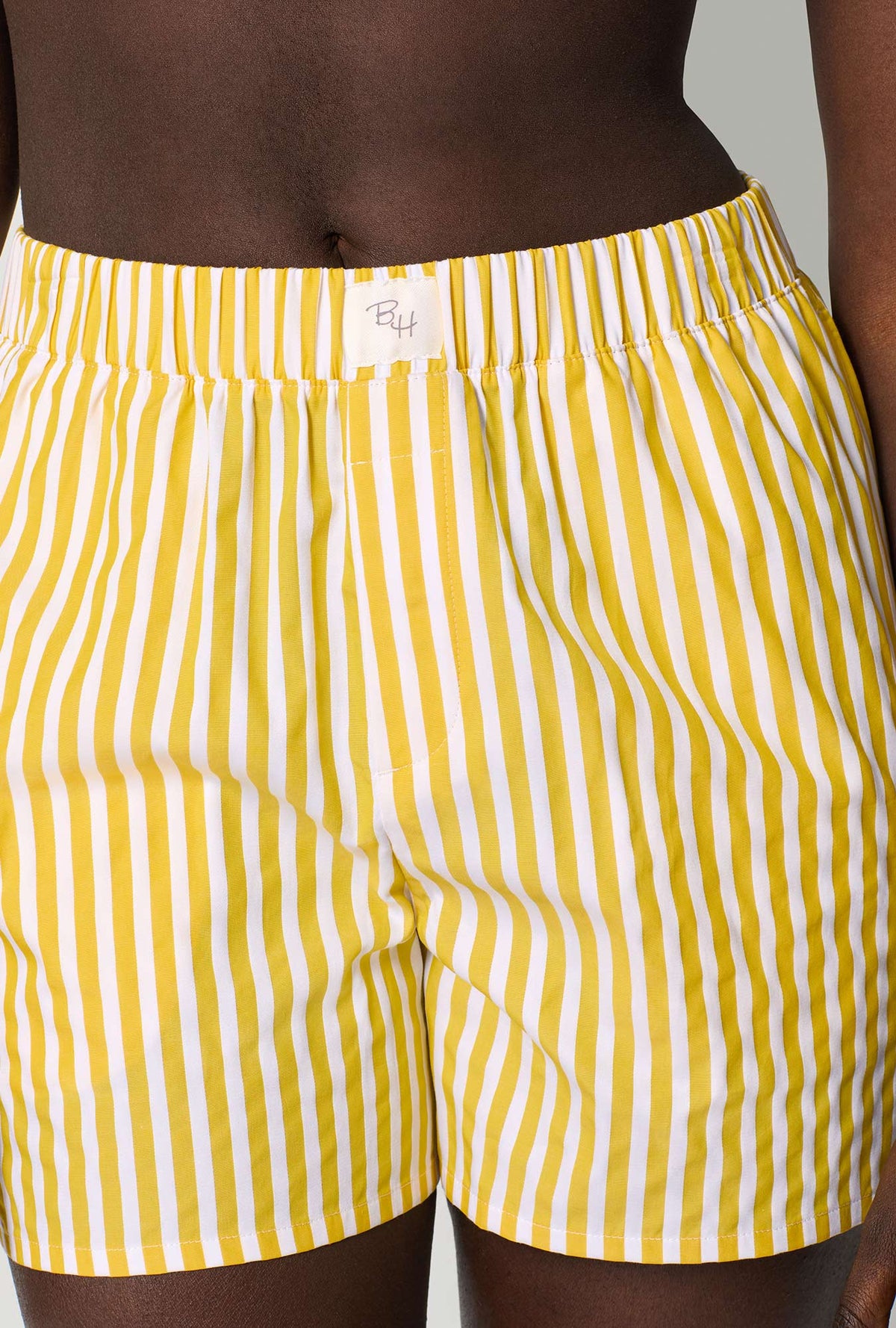 A closeup of A lady wearing Yellow Cotton Sateen Boxer Short