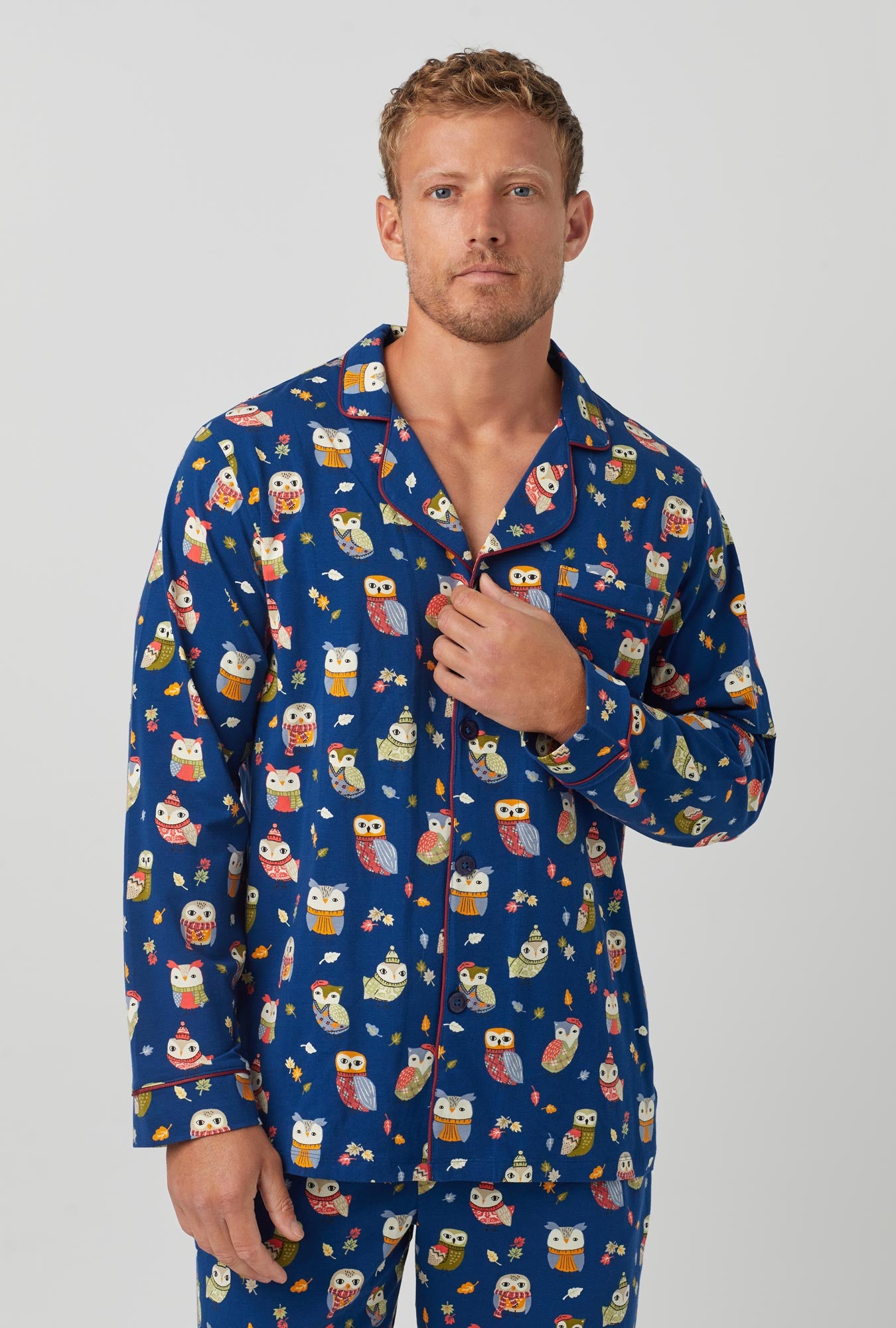 A man wearing long sleeve classic stretch jersey pj set with autumn owls print