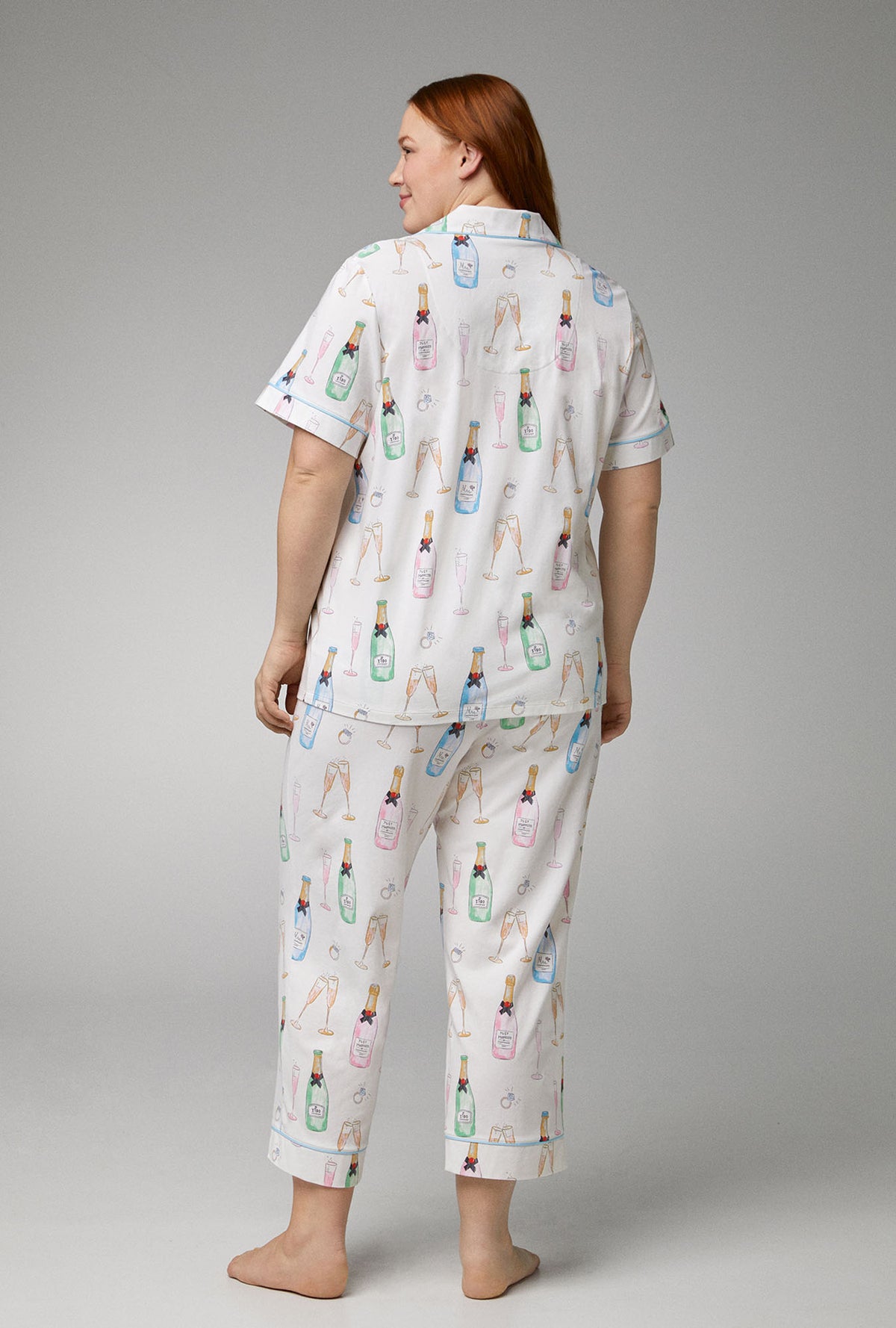 A lady wearing Short Sleeve Classic Stretch Jersey Cropped plus size  PJ Set with Champagne Wedding print