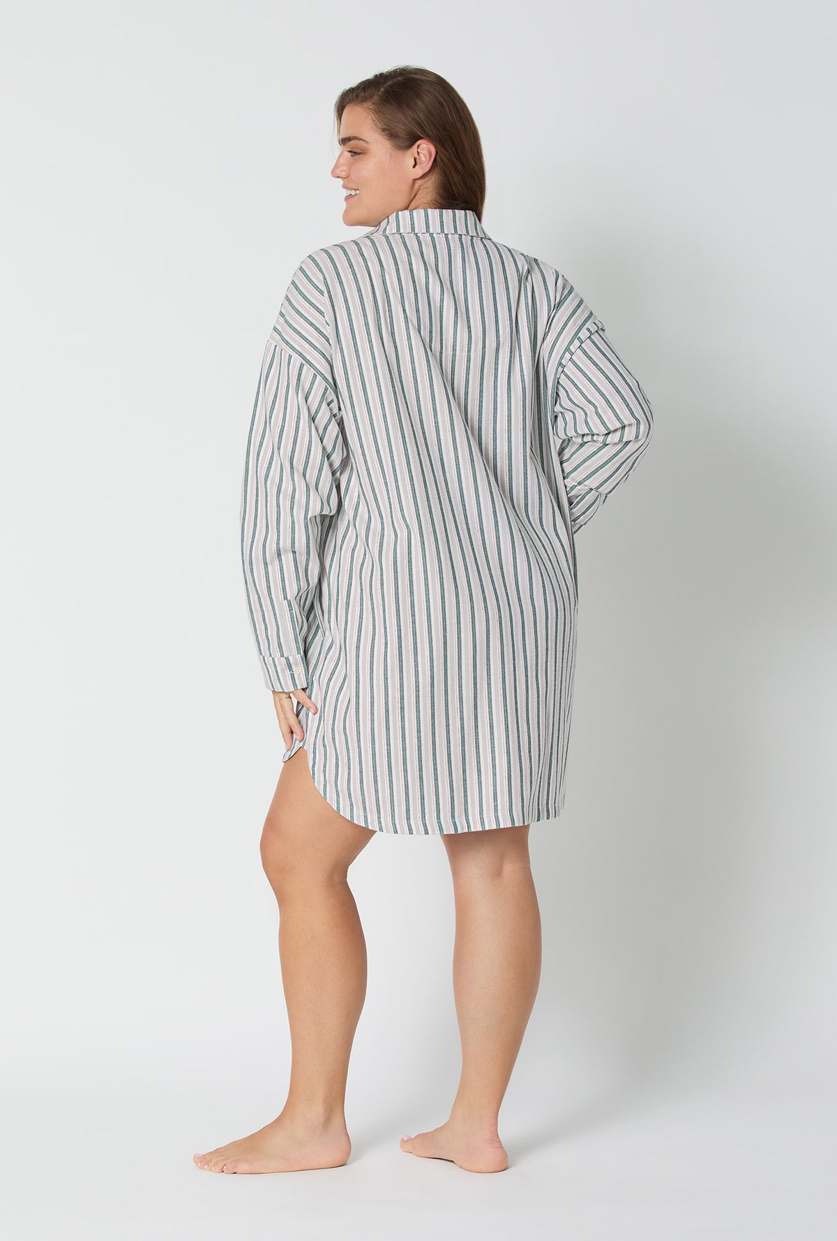A lady wearing Peppermint Stripe High Low Woven Portuguese Flannel Boyfriend Shirt