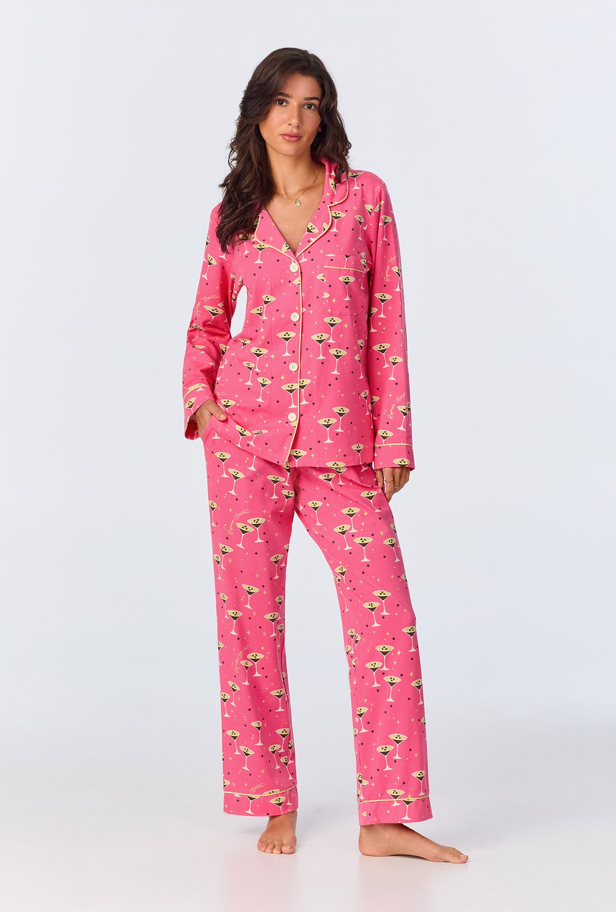 A lady wearing pink long sleeve pajama set with espresso print.