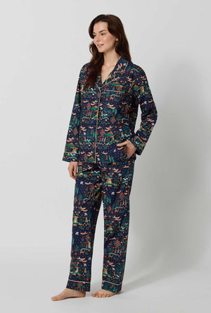 A lady wearing Rifle Paper Co. x BedHead PJs Nativity Long Sleeve Classic Woven Cotton Poplin Pj Set looking side